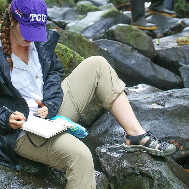 girl on rocks in Costa Rica