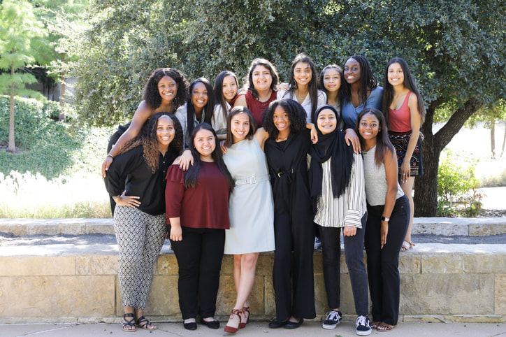 Members of the Molding Melanin Magic program posing as a group outside
