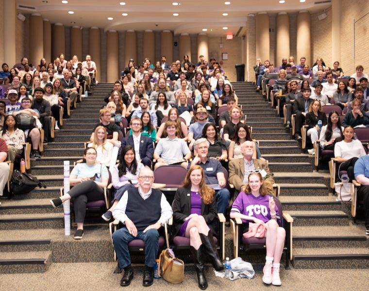 Students, faculty and special guests take a group photo for SRS.