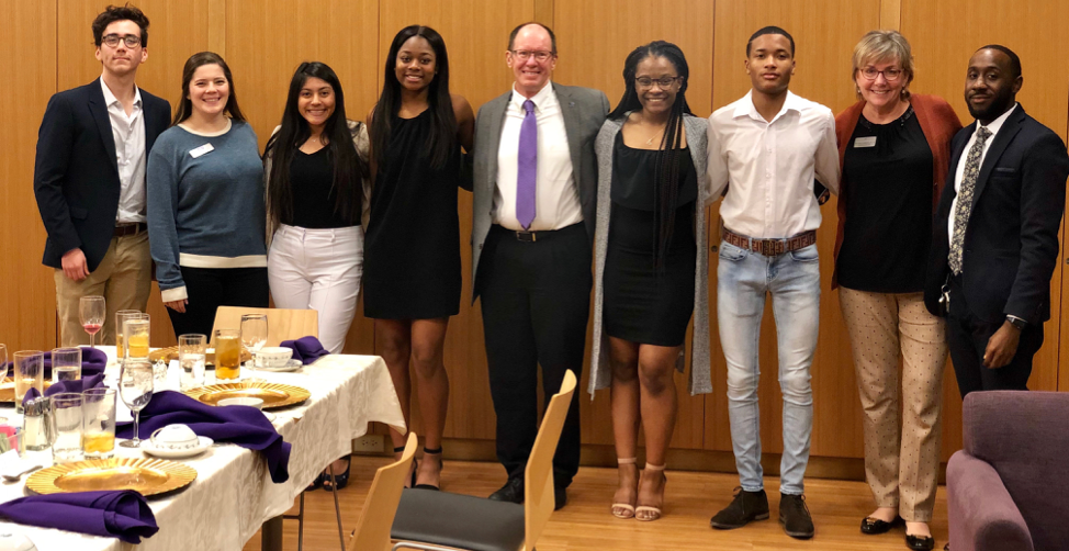STEM Scholars posing in a line along with Dean Phil Hartman and professor Ann VanBeber
