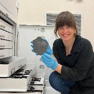 Rhiannon Mayne holding a meteorite