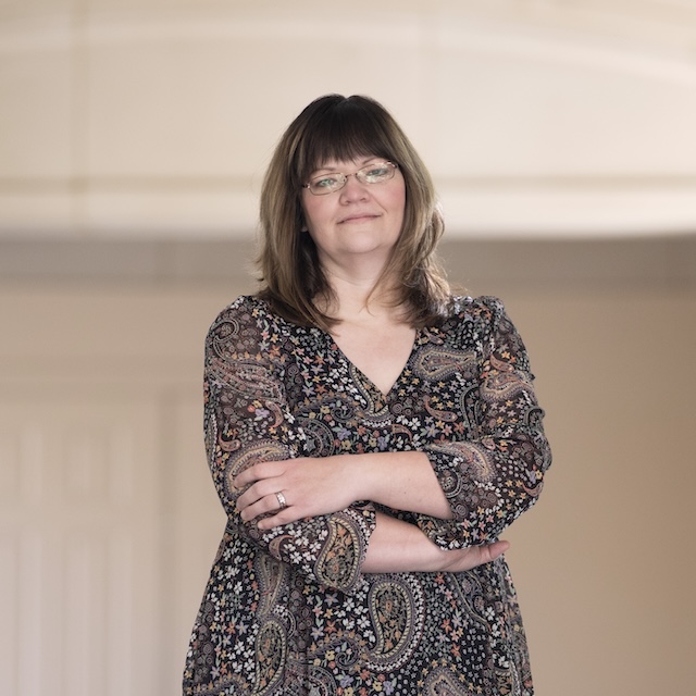 Professor Cathy Cox poses on campus.