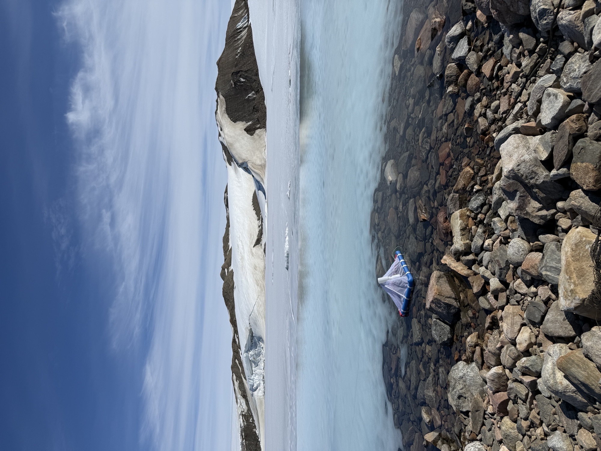 A floating trap is set to collect aquatic insects emerging from Arctic ponds.