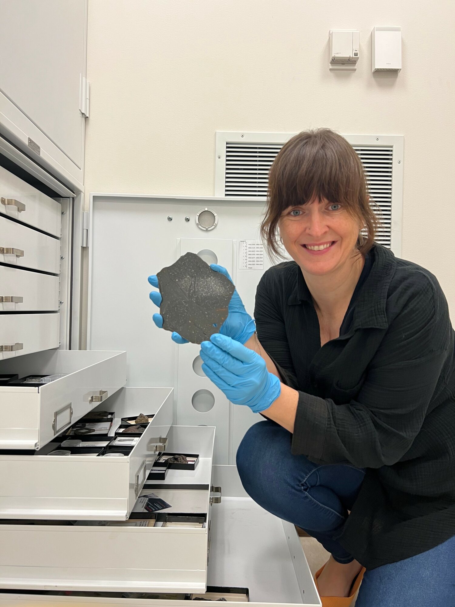 Rhiannon Mayne holds up meteor. 