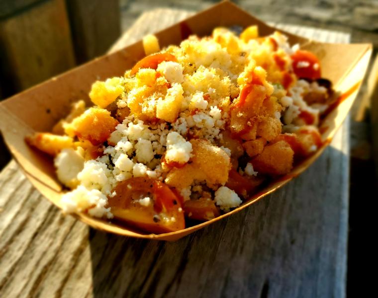 fresh seafood dish in a paper bowl